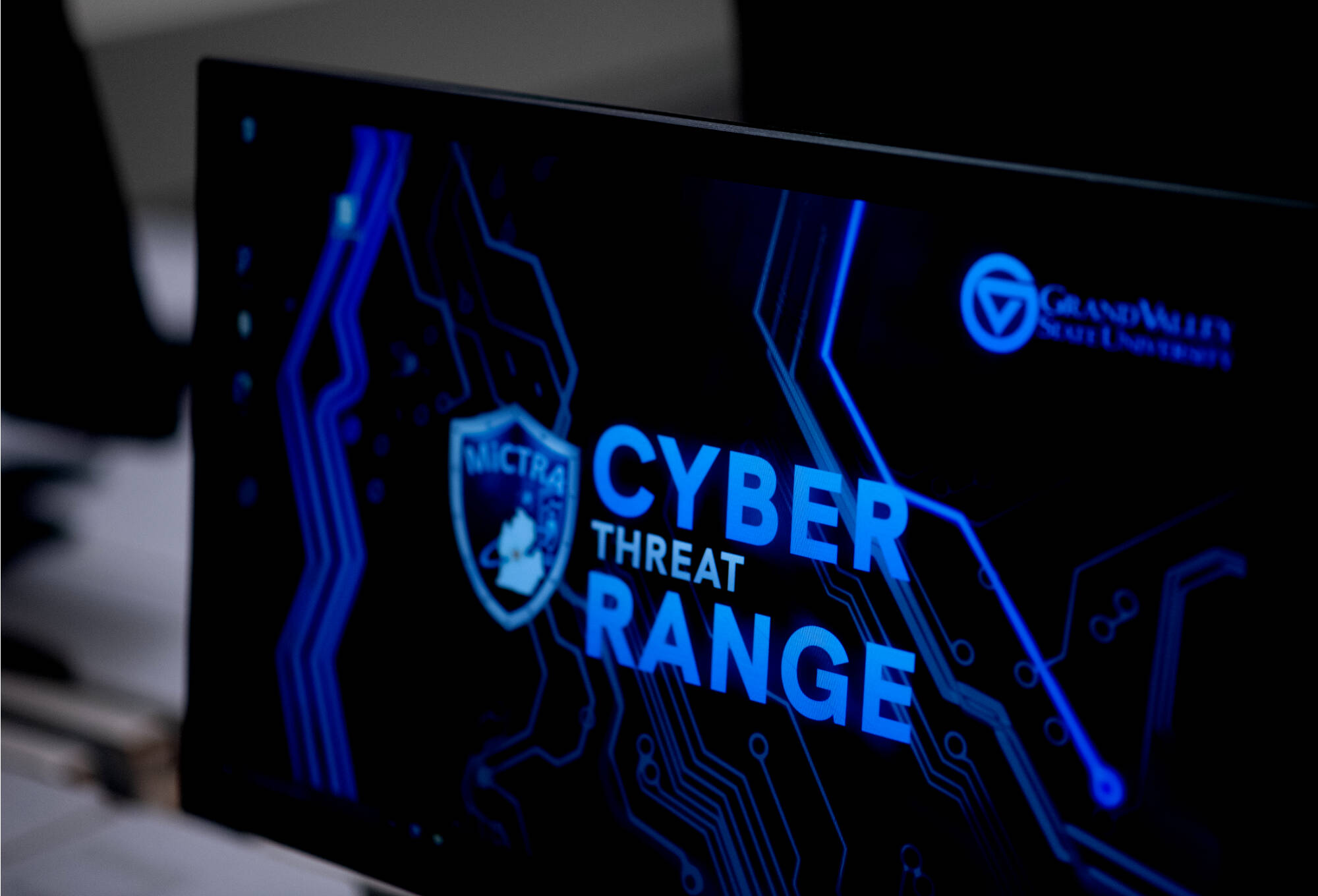 Monitor with "Cyber Threat Range" inscription